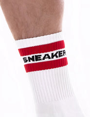 White athletic sneaker half sock by barcode berlin with bold red stripe and black lettering on the cuff size s/m