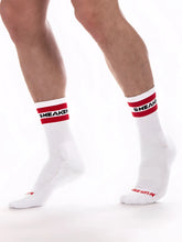 White crew socks with red and black sneaker branding on cuff barcode berlin fetish sneaker half socks size s/m