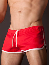 Red barcode berlin gym shorts in size s/m featuring white trim and drawstring swim trunks design