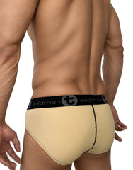 Beige big boy pouch cotton briefs with black elastic waistband featuring wildman logo and stylized t emblem