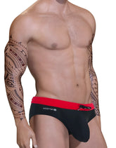 Black swim trunks with red waistband and wildman logo from the big boy pouch swim bikini red collection