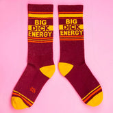 Big dick energy crew socks in maroon and yellow stripes featuring bold text and textured knit material
