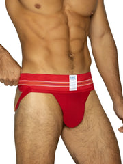 Red bike athletic briefs with striped waistband and white label featuring bike brand name in vibrant red color