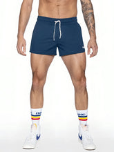 Navy blue bike track short with white drawstrings and a small logo on the lower right leg for athletic wear