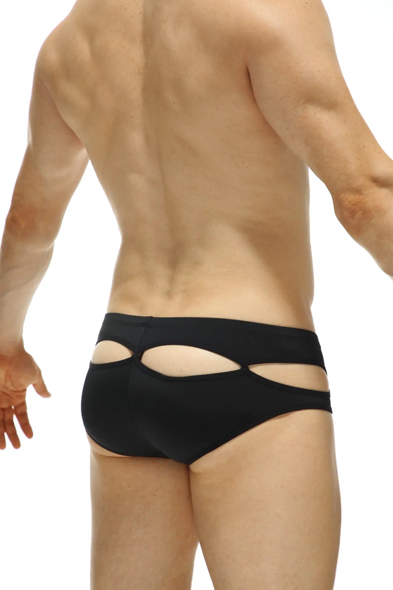 Black cut-out swim trunks with a sleek modern design from bikini carlat featuring a bold and stylish look