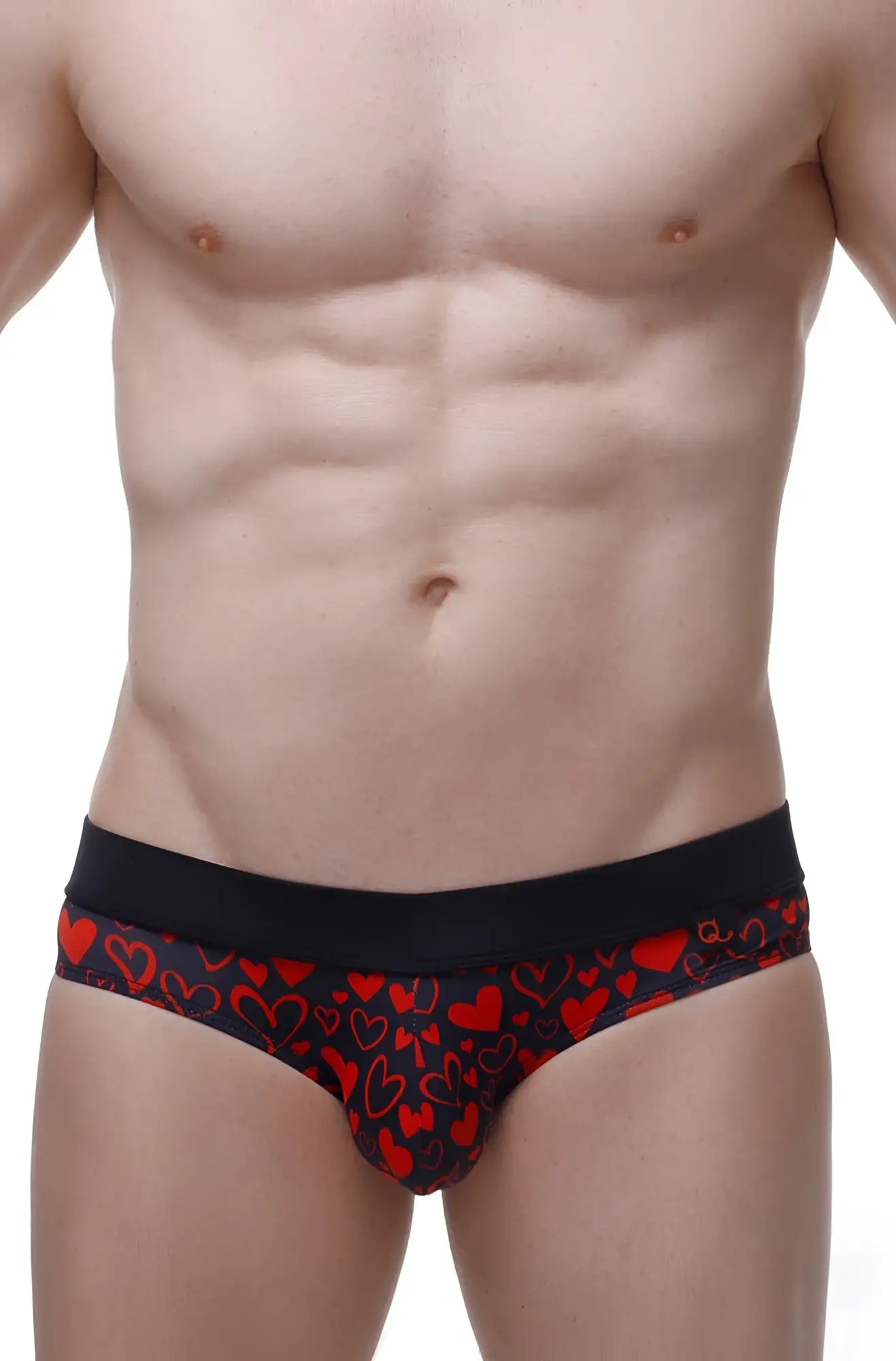 Black bikini briefs with vibrant red heart pattern in cotton fabric from Céron king of hearts collection