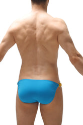 Bright blue swim trunks with yellow decorative clasp on the side from bikini chains turquoise collection