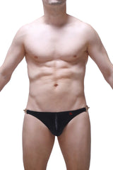Black men’s bikini conguel satin swim trunks in black with gold-tone metal side accents and a small red logo on front