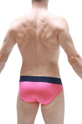 Bright pink bikini mega bulge briefs with a contrasting navy blue waistband for enhanced comfort and style