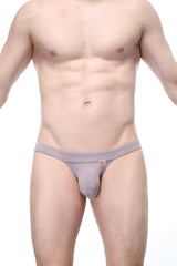 Gray men’s thong with a small red logo on the waistband made of organic bamboo from petitq bikini sillas organic bamboo peanut