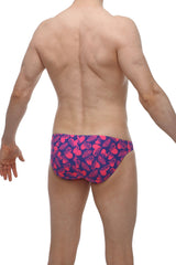 Petitq bikini taik tropical hearts vibrant pink and navy blue swim trunks with playful tropical leaf pattern