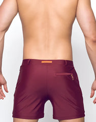 Maroon bondi short athletic shorts with subtle textured finish and orange rectangular brand tag at the waistband