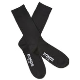Black cotton bonds everyday oxford crew socks size 6-10 showing white branding on heel back side view