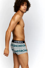 Light blue and white patterned bonds allover logo fit trunk underwear with black waistband size m front view