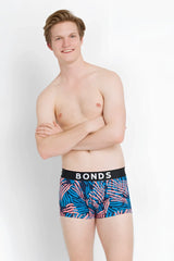 Bonds fit trunk boxer brief underwear in xs with blue and pink tropical leaf pattern and black waistband
