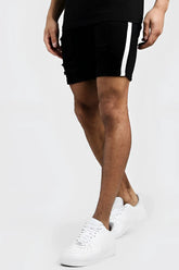 Black distressed boohoo skinny fit denim shorts with white vertical side tape in size 32