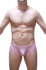 Pink men’s boxer briefs in tea rose with a small red logo on the waistband designed for chill comfort