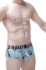 Light blue men’s boxer briefs with playful toucan pattern and black petitq branded waistband in front view