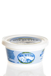 A white plastic container of boy butter water based gel with blue and yellow branding for personal lubrication