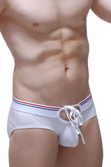 White men’s brief almard swim trunks with red white and blue striped waistband and matching drawstring
