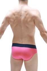 Brief matraux fuchsia bright pink swim trunks with a contrasting navy blue waistband for beachwear
