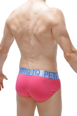 Bright pink modal briefs with light blue x-cross elastic waistband featuring petitq logo in repeating lettering