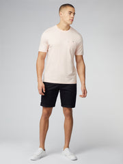 Pale pink short-sleeved crew neck signature t-shirt with small embroidered logo and chest pocket for casual wear
