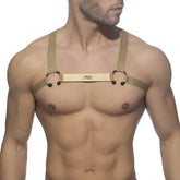 Gold leather bull ring harness with black spherical accents and central branded strap for bold style