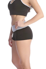 Black and gray athletic crop top bumble short with cutout neckline designed for workout comfort