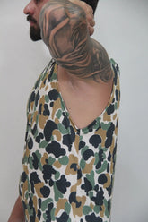 Camouflage open arm tank sleeveless top with white base black and olive green splotches for casual wear
