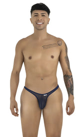 Model wearing CandyMan navy mesh thongs with thin, minimal side straps, posed standing against a white background.