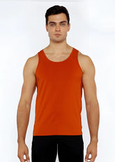 A solid orange stretch jersey tank top with circle spine laser cut detail and a simple round neckline