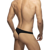 Black cotton thong underwear showing the back side made of breathable soft cotton fabric