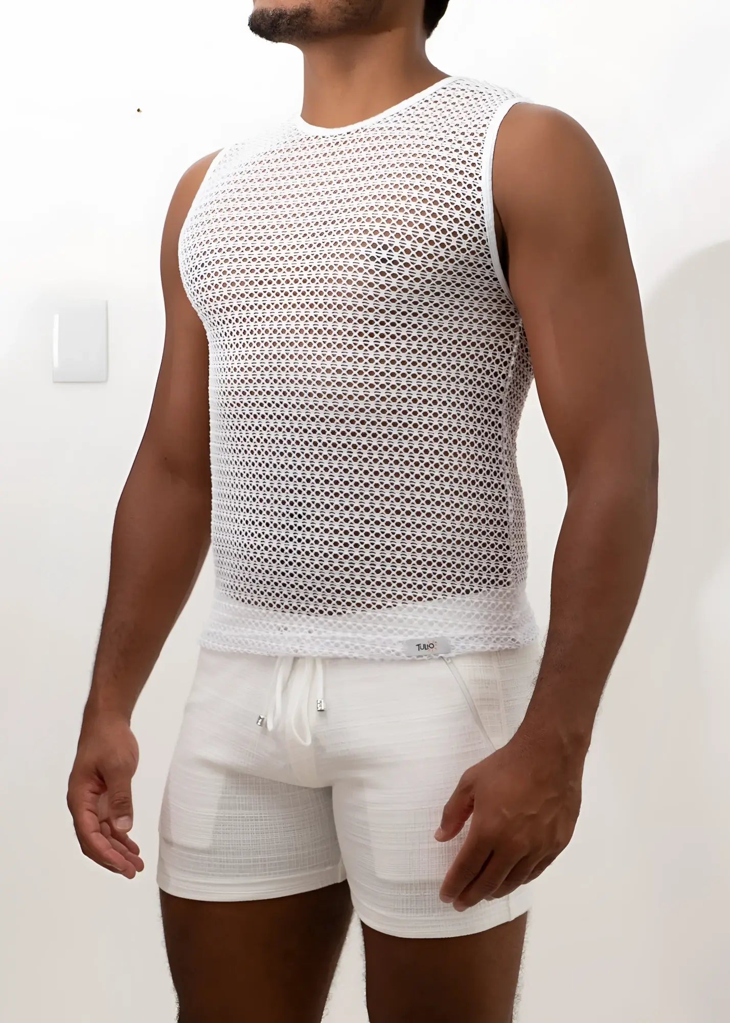 White crochet muscle tank top with sleeveless design mesh texture and round neckline for casual wear