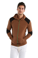 Form-fit crossover yoga track performance hoodie in chocolate with black featuring a green zipper pull and zip-up front