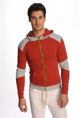 Form-fit crossover yoga track performance hoodie in cinnabar grey with red and gray zip-up design and green zipper