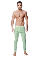 Light green crosstrain thermal yoga pant with form-fitting compression tights and elastic waistband with colorful geometric design