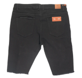 Black denim cut off short by crysp denim with slim fit back side showing two pockets and orange brand tags