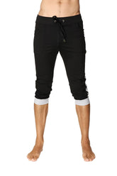 Black cuffed yoga pants with grey contrasting cuffs and side stripes in capri-length jogger style