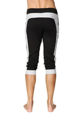 Black and grey cuffed yoga pants with ribbed waistband side panels and rolled cuffs for athletic wear