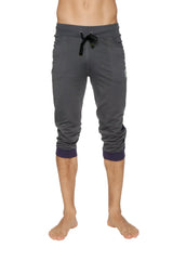 Dark gray heathered cuffed yoga pants with navy ribbed cuffs and black drawstring waistband in charcoal w eggplant