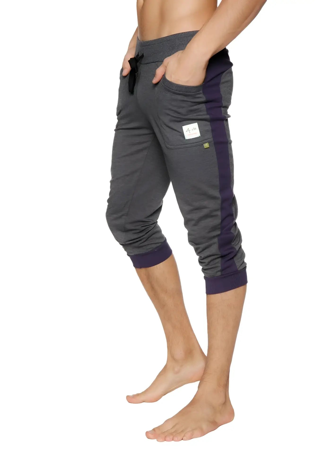 Dark gray and navy blue cuffed yoga pants with elastic waistband side stripe and ribbed cuffs for athletic wear