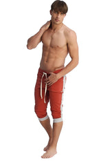 Red athletic shorts with white side stripes and matching drawstring designed for activewear and casual use