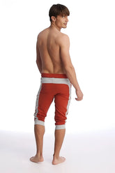 Cuffed yoga pants in cinnabar and grey featuring ribbed cuffs and a comfortable athletic capri design