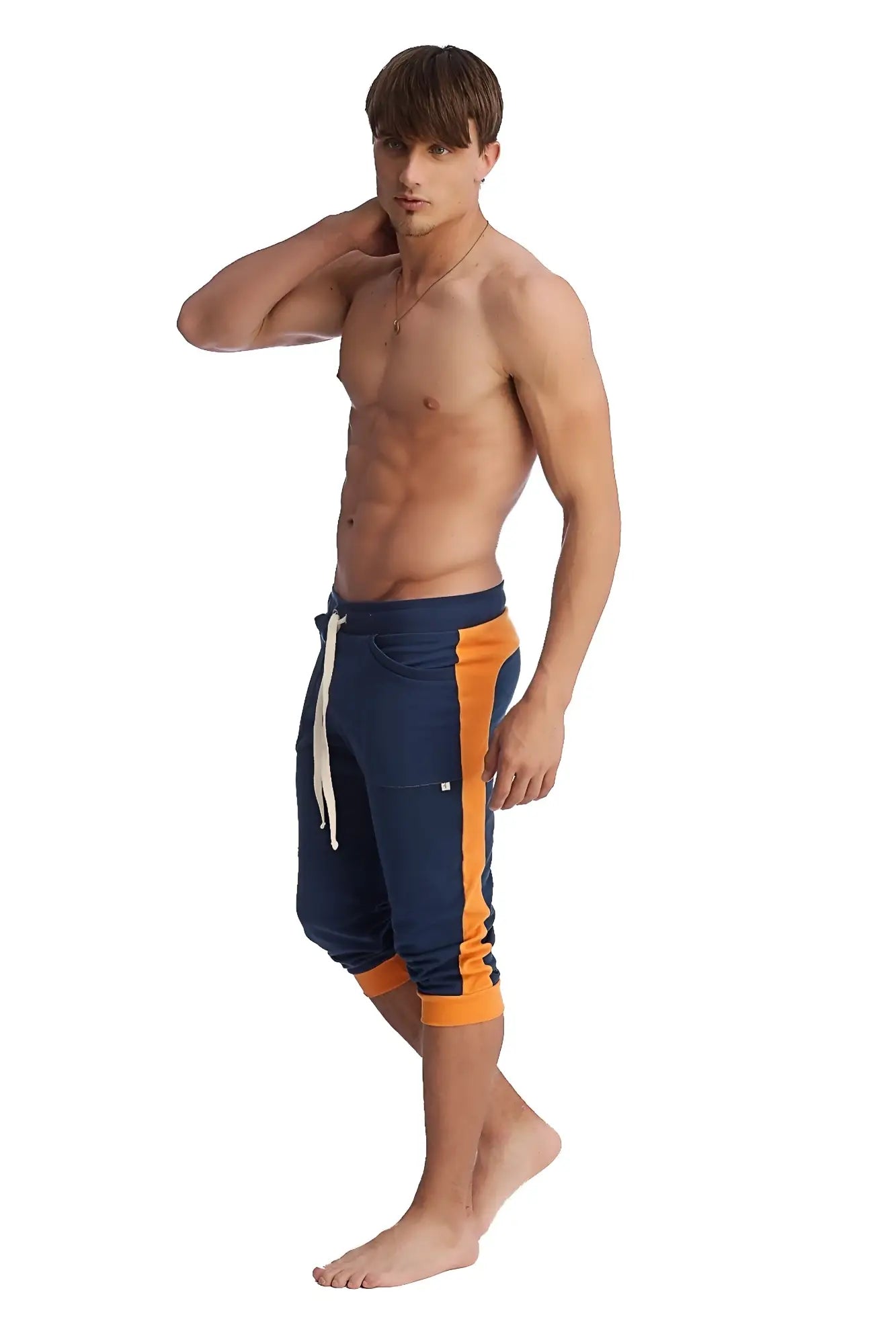 Cuffed yoga pants in royal blue and orange with navy blue and orange athletic shorts featuring a white drawstring