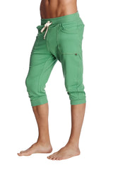 Green capri-length cuffed yoga pants with drawstring waistband and side pockets made from solid bamboo material