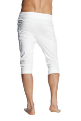 White cuffed yoga pants with a relaxed fit and elastic waistband in solid cotton fabric for comfortable wear