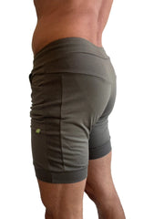 Olive green cuffed yoga shorts with ribbed side panels and elastic waistband for athletic wear