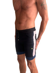 Cuffed yoga short in black with white vertical stripe and navy trim featuring drawstring waistband and side pockets