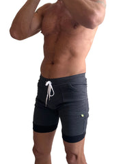 Charcoal cuffed yoga shorts with black trim cuffs and white drawstring detail for athletic wear